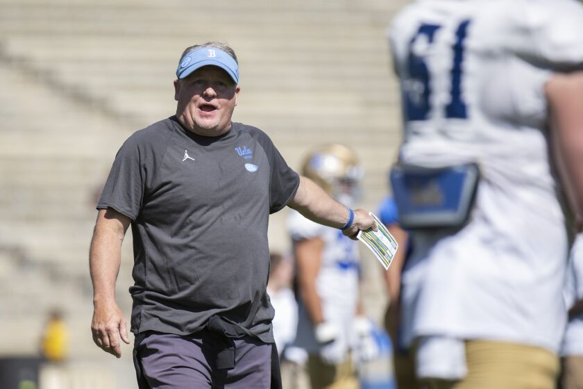 Los Angeles, CA - April 23: UCLA head coach Chip Kelly gives instructions to his players during Spring Showcase in Los Angeles, CA. (Kyusung Gong / For the LA Times)