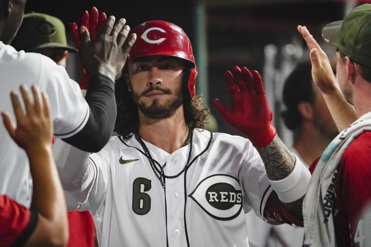 Cincinnati's Jonathan India celebrates with teammates after scoring on a home run against the Pittsburgh Pirates.