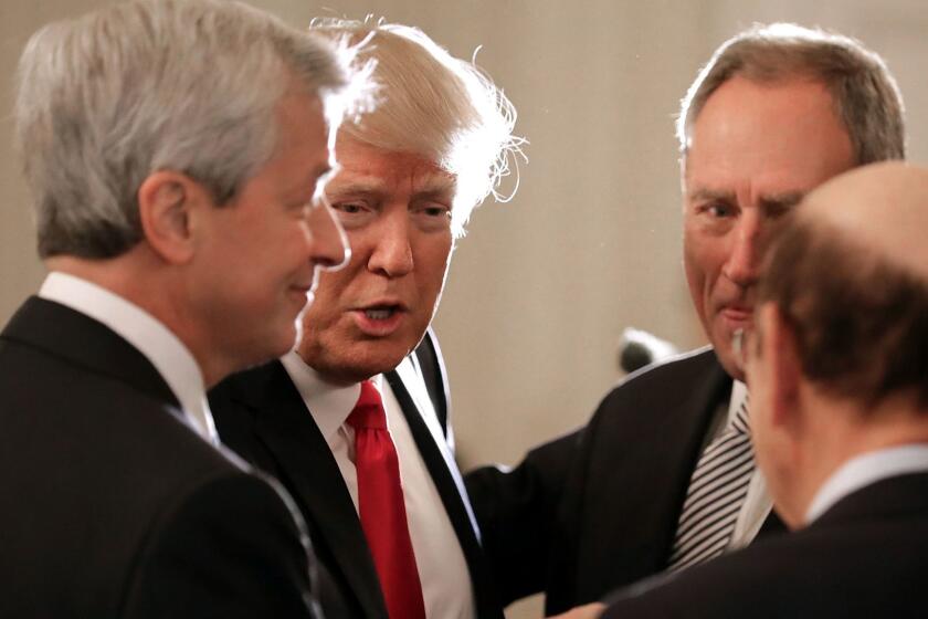 WASHINGTON, DC - FEBRUARY 03: U.S. President Donald Trump (2nd L) greets JPMorgan Chase CEO Jamie Dimon (L) and other guests at the beginning of a policy forum in the State Dining Room at the White House February 3, 2017 in Washington, DC. Leaders from the automotive and manufacturing industries, the financial and retail services and other powerful global businesses were invited to the meeting with Trump, his advisors and family. (Photo by Chip Somodevilla/Getty Images) ** OUTS - ELSENT, FPG, CM - OUTS * NM, PH, VA if sourced by CT, LA or MoD **