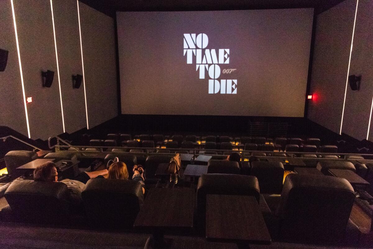 Guests watch trailers before a screening of "Tenet" at The Lot in Liberty Station on Wednesday.