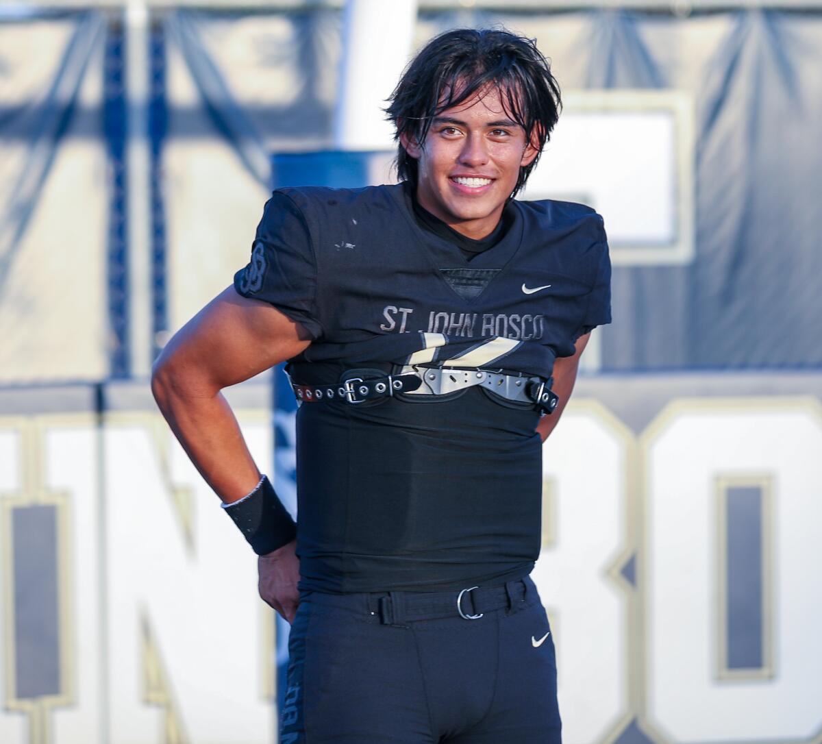 Quarterback Caleb Sanchez of St. John Bosco is all smile as he warms up.