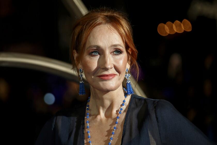 Author J.K. Rowling poses for photographers upon her arrival at a premiere in London in 2018.