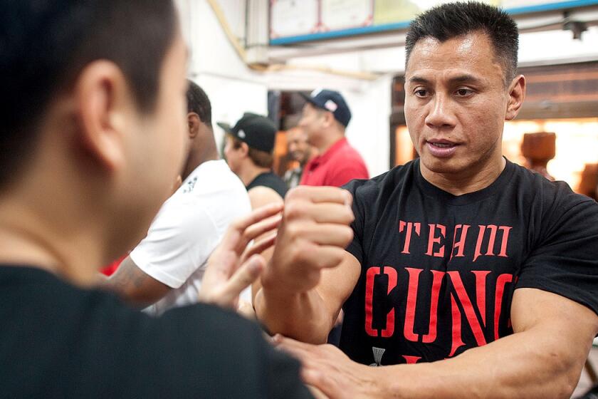 UFC middleweight fighter Cung Le practices Wing Chun during a training session in Hong Kong before his bout against Michael Bisping this summer.