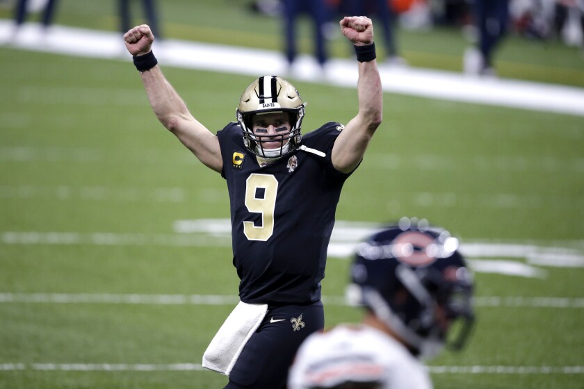 New Orleans Saints quarterback Drew Brees celebrates a touchdown by Alvin Kamara.