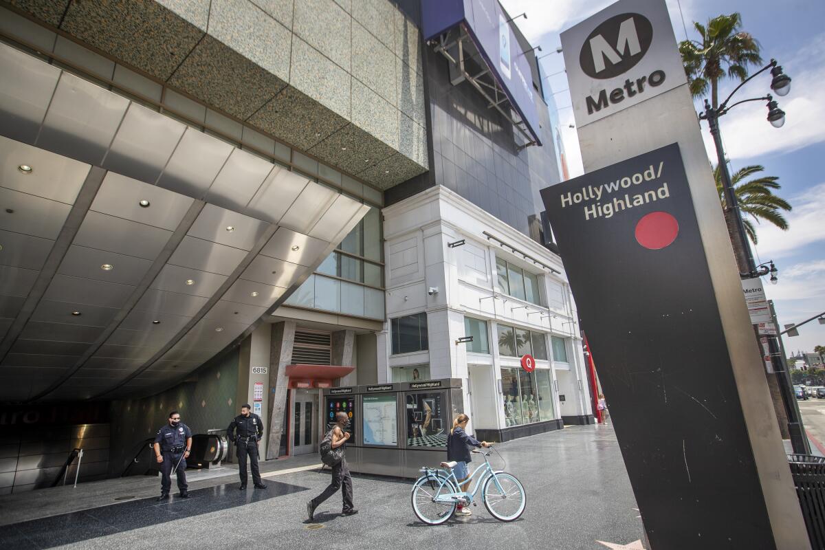 Two LAPD officers patrol the Hollywood/Highland Metro station.