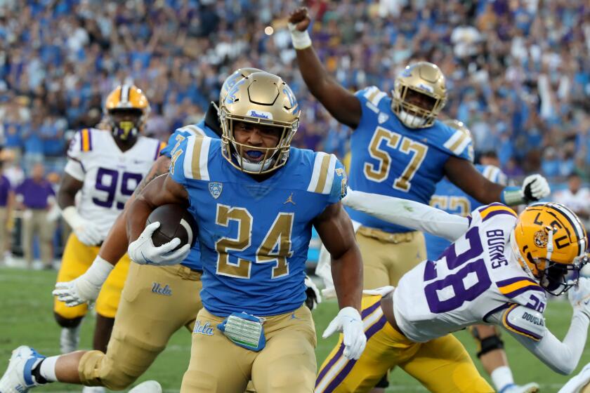 UCLA running back Zach Charbonnet scores against LSU at the Rose Bowl on Sept. 4, 2021.
