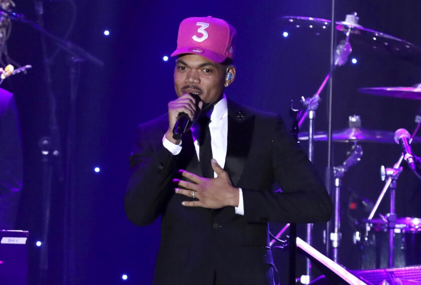 FILE - Chance the Rapper performs on stage at the Pre-Grammy Gala And Salute To Industry Icons on Jan. 25, 2020, in Beverly Hills, Calif. The Grammy winner is bringing a secret concert filmed four years ago to the big screen next month. Titled "Magnificent Coloring World," the film premieres Aug. 13, 2021, in select AMC Theatres. (Photo by Willy Sanjuan/Invision/AP, File)