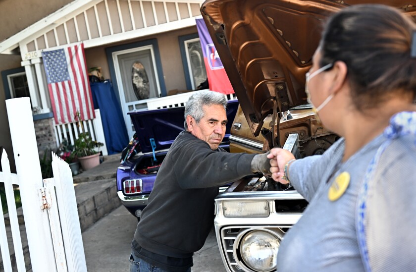 Community activist Eunisses Hernandez, who is running for L.A. City Council, talks with a resident of Glassell Park.