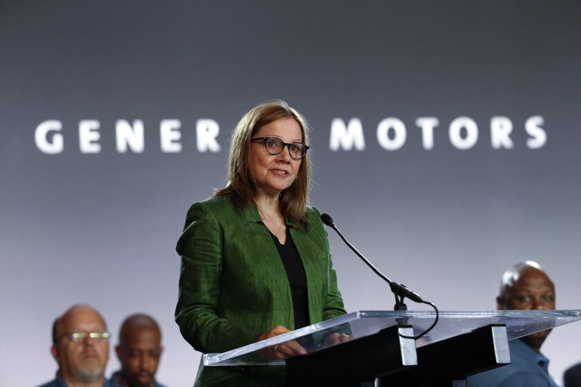 General Motors CEO Mary Barra speaks at a lectern.