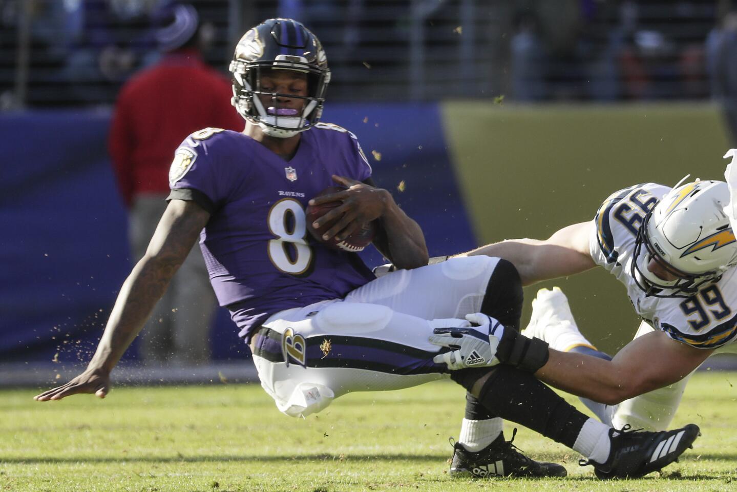 Chargers defensive lineman Joey Bosa sacks Ravens quarterback Lamar Jackson during the first quarter.