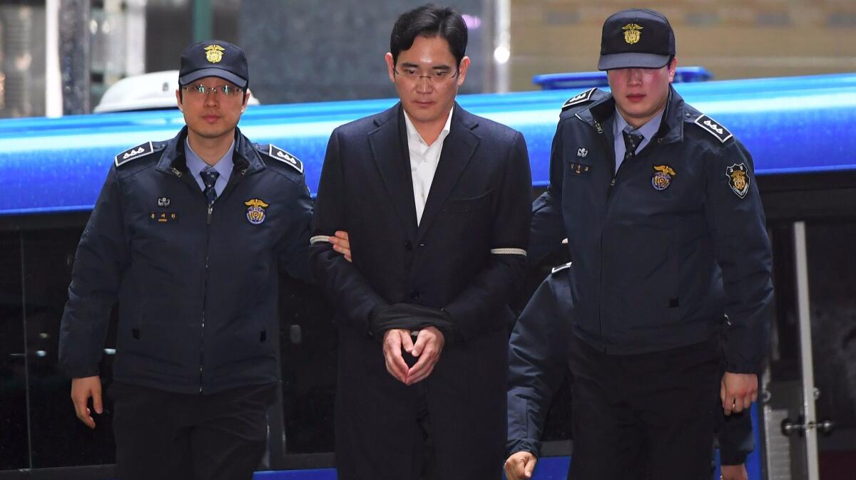 Lee Jae-yong, Samsung Electronics executive, arrives for questioning at the office of a special prosecutor investigating a corruption scandal in South Korea.