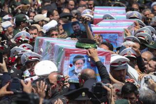 In this photo released by the Iranian Presidency Office, flag-draped coffins of the President Ebrahim Raisi and his companions who were killed in a helicopter crash on Sunday, during their funeral ceremony in the city of Mashhad, Iran, Thursday, May 23, 2024. Iran on Thursday prepared to inter its late president at the holiest site for Shiite Muslims in the Islamic Republic, a final sign of respect for a protégé of Iran's supreme leader killed in a helicopter crash earlier this week. (Iranian Presidency Office via AP)