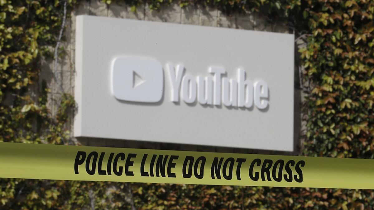 Police tape is shown outside of a YouTube office building in San Bruno, Calif., on April 4.