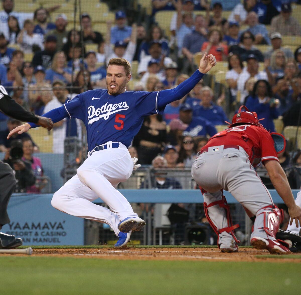 Freddie Freeman scores in the third inning against the Angels during a Freeway Series game April 5.