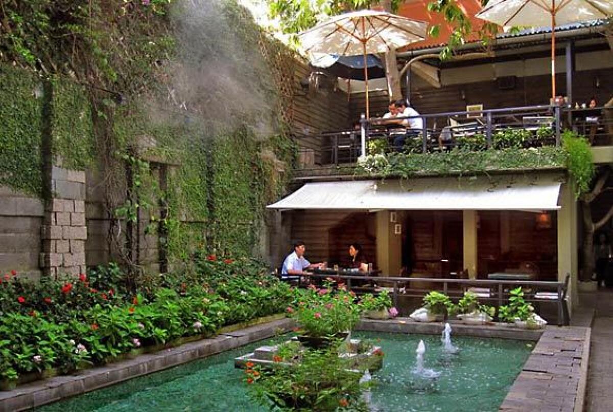 Patrons can relax by the fountains at Du Mien Café in Ho Chi Minh City, Vietnam