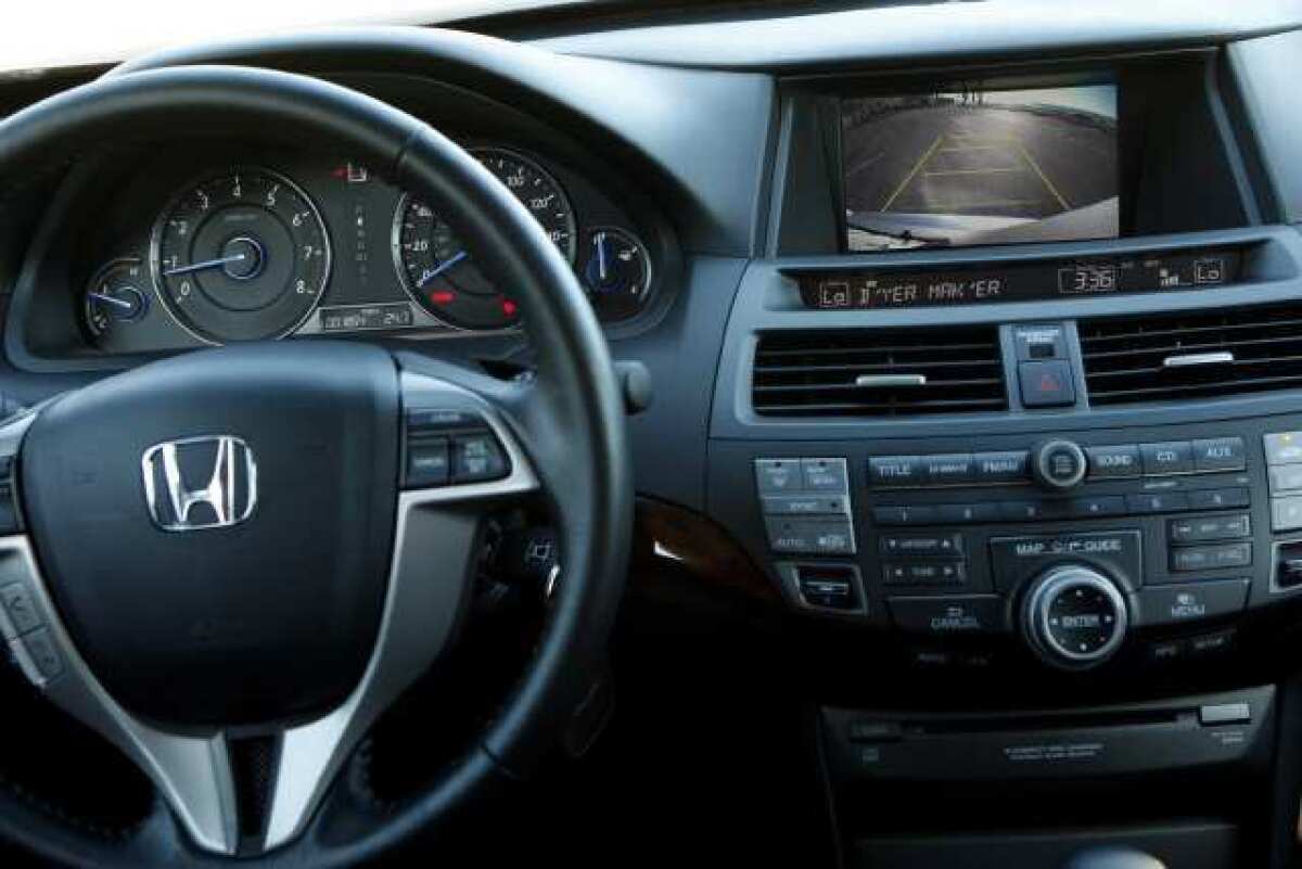 The dashboard of the Honda Crosstour features a rearview camera and monitor that are used when the car is backing up. The function may be required in new cars by 2014.