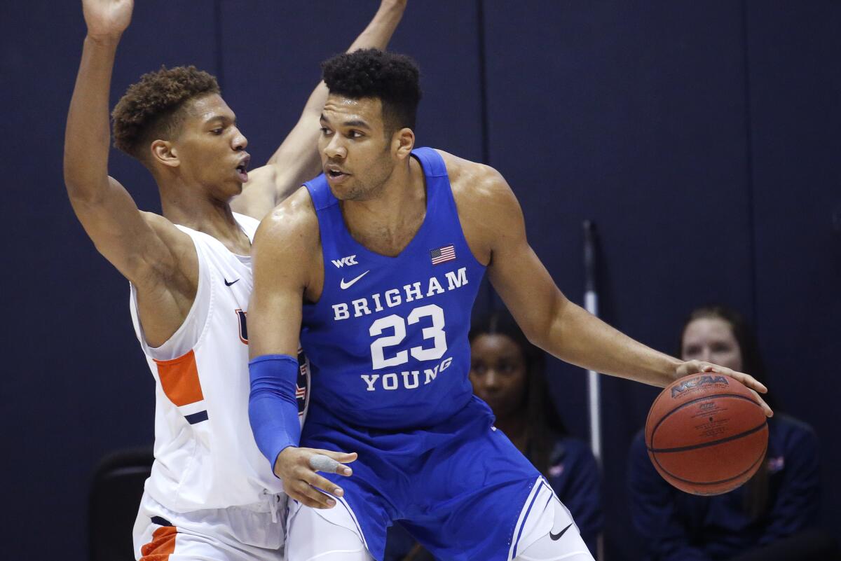 Brigham Young's Yoeli Childs is defended by Pepperdine's Kessler Edwards on Feb. 29, 2020.