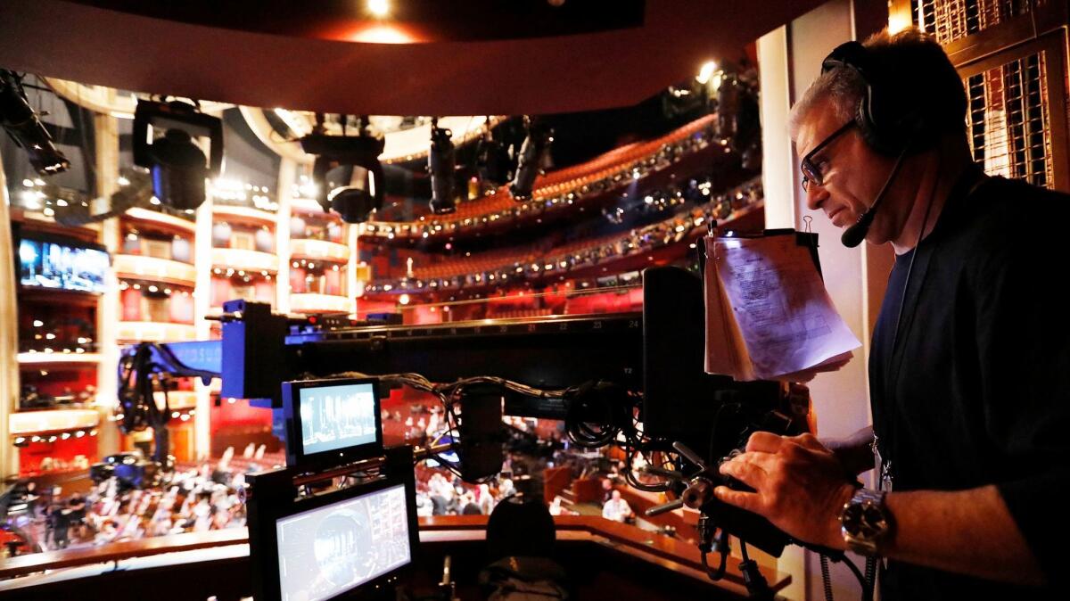 Techno-Jib operator Jay Kulick positions the camera at the end of the boom for a shot during rehearsals in the Dolby Theatre in Hollywood before the 89th Academy Awards ceremony.