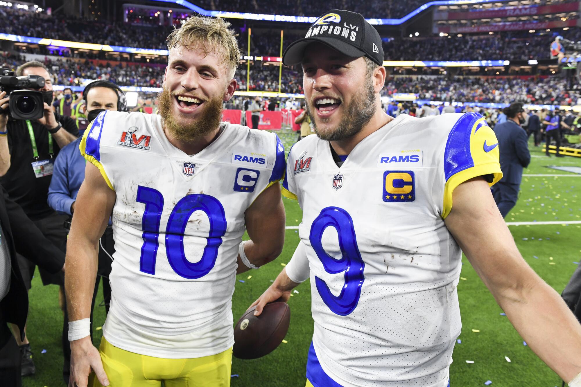 Rams Cooper Kupp (10) and Matthew Stafford celebrate after their Super Bowl victory over the Bengals.