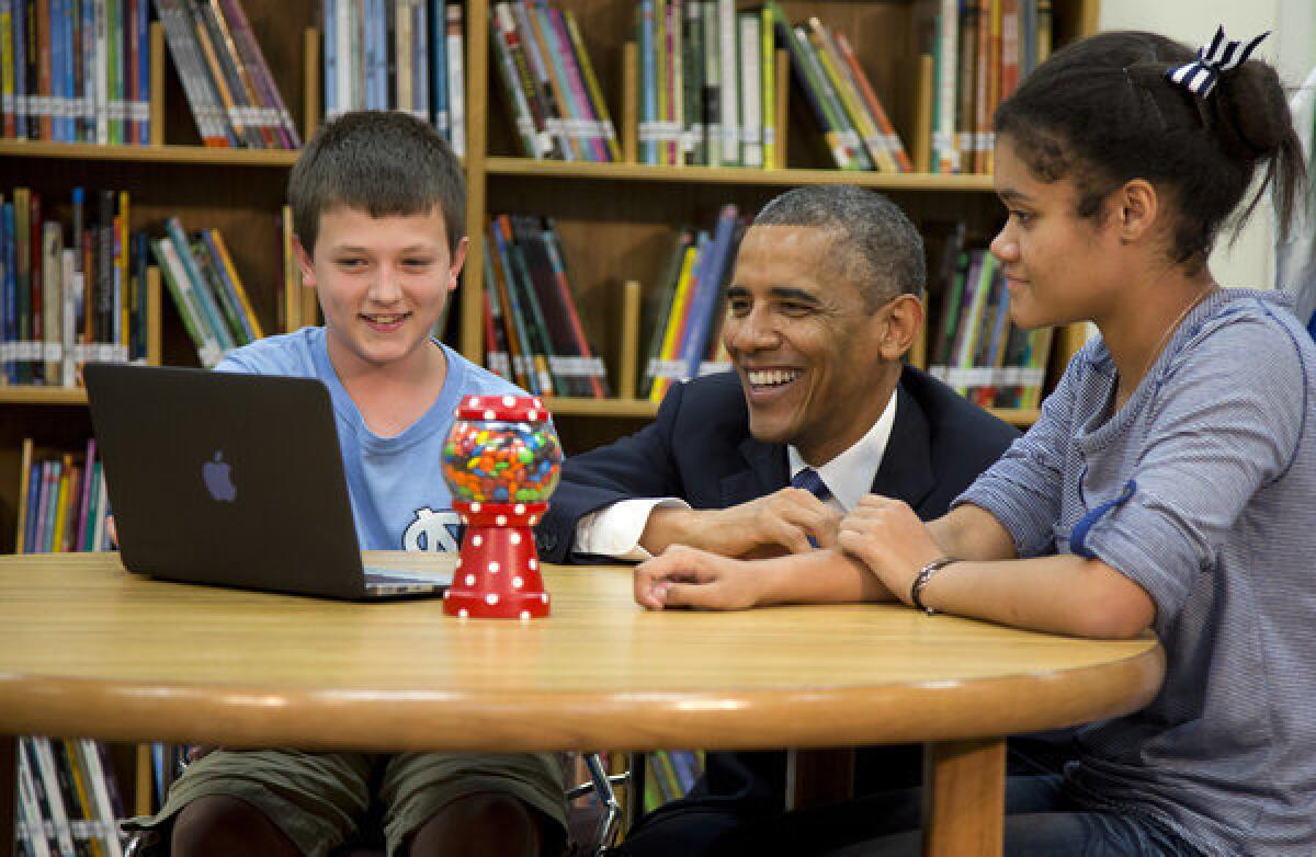 President Obama views a math project during a tour of Mooresville Middle School in Moorseville, N.C.