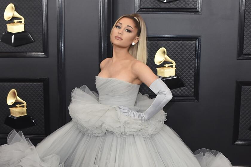 Ariana Grande in a grey tulle gown and gloves at the Grammys red carpet