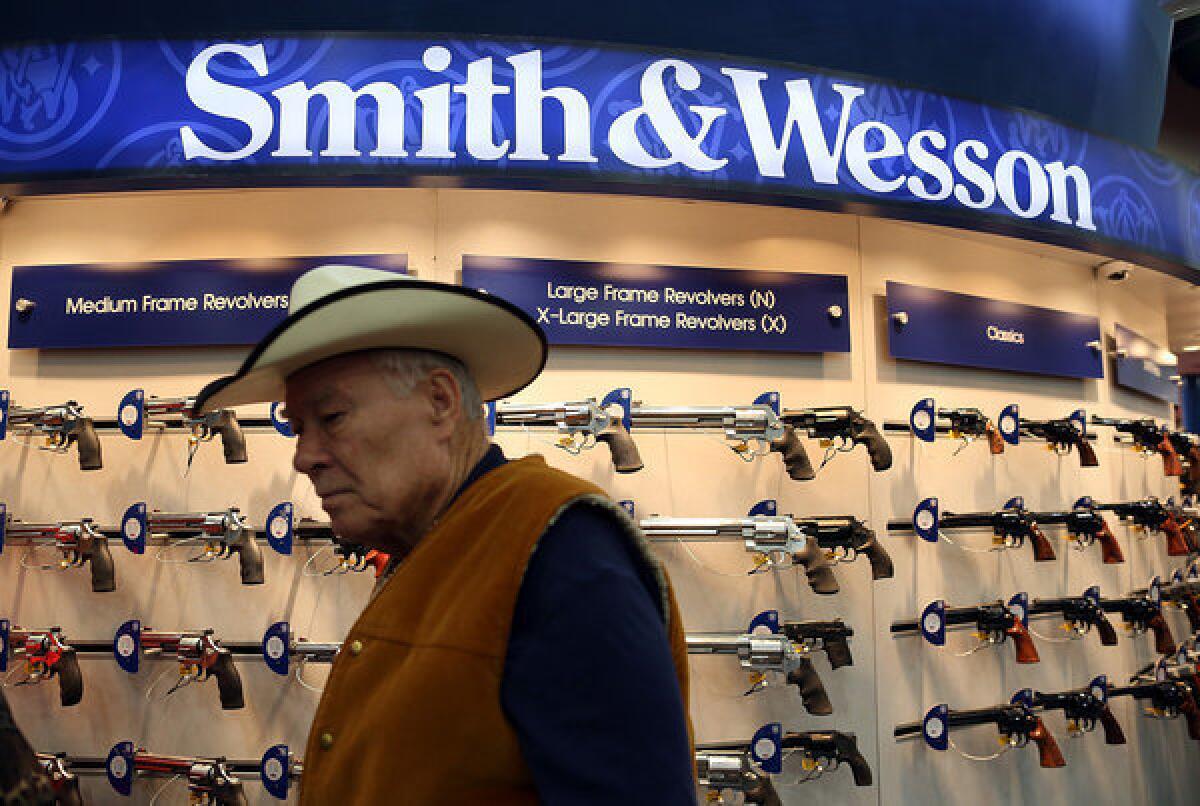 Smith & Wesson said its fourth-quarter results may exceed Wall Street expectations. Above, a Smith & Wesson display at the National Rifle Assn.'s annual meeting in Houston in May.
