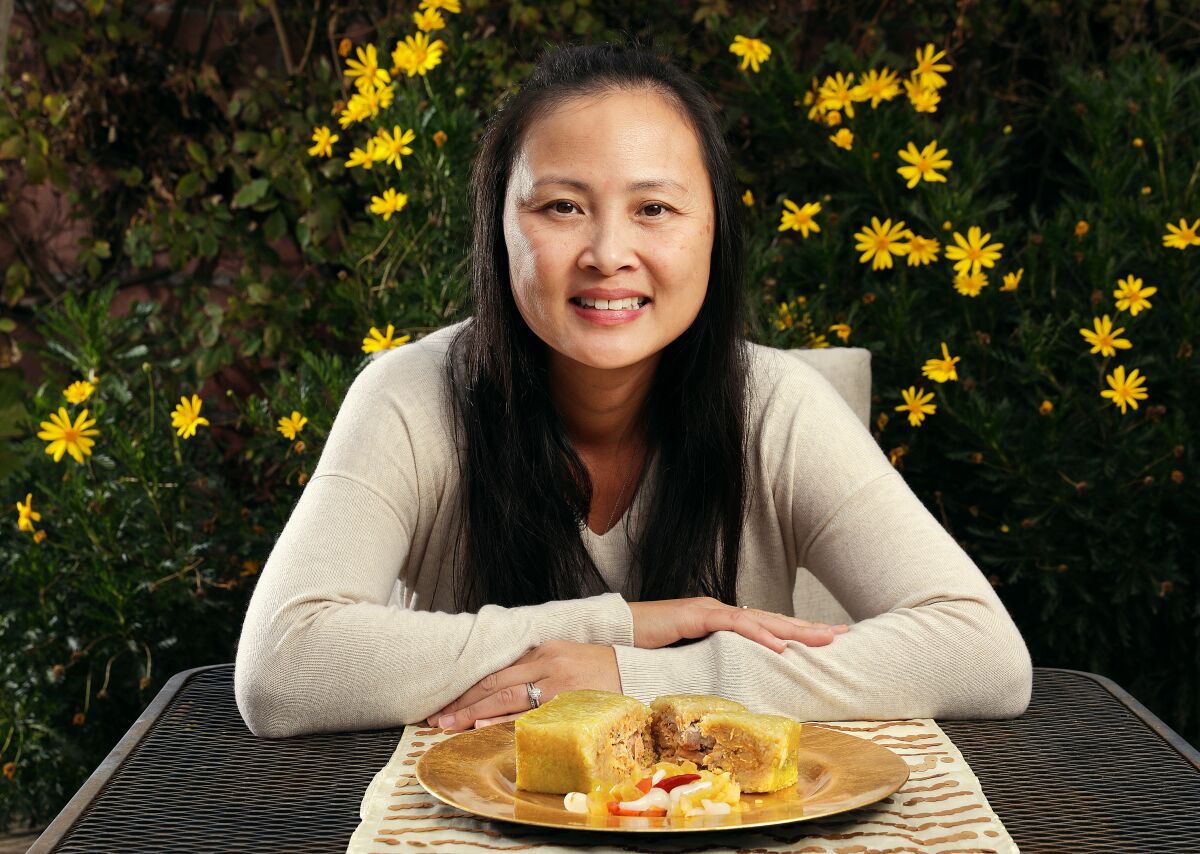 Kim Xuyen Ngo at home in Westminster with a dish of Banh Chung-a delicacy for the Lunar New Year