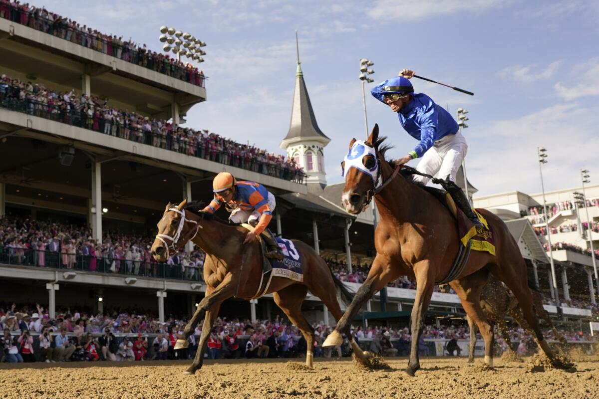 Pretty Mischievous (14), with Tyler Gaffalione aboard, wins the 149th running of the Kentucky Oaks.