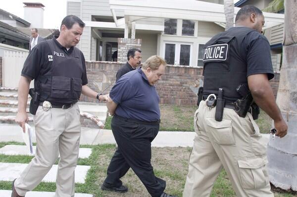 The small city of Bell in Southeast L.A. County has become synonymous with corruption after The Times revealed huge salaries paid to top officials. L.A. County prosecutors have since charged eight former and current officials with numerous counts of public corruption. Former Bell City Administrator Robert Rizzo, above, is taken into custody at his Huntington Beach home before being booked into L.A. County Jail. He had an annual salary and benefits package of more than $1.5 million. Top 10 national stories of 2010 Top 10 international stories of 2010 Top 10 business stories of 2010 Top 10 sports stories of 2010 Notable deaths of 2010 2010: The Year in Pictures