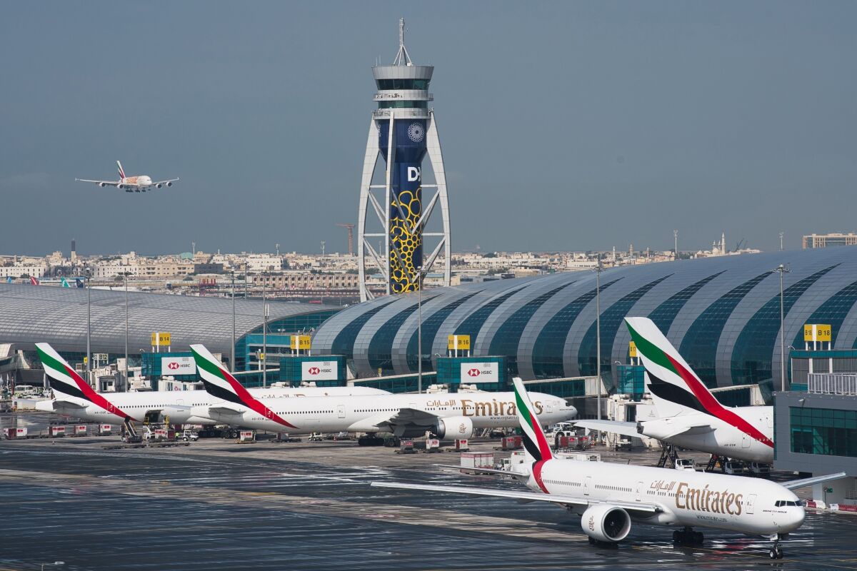 FILE - An Emirates jetliner comes in for landing at the Dubai International Airport in Dubai, United Arab Emirates, Dec. 11, 2019. Long-haul carrier Emirates successfully flew a Boeing 777 on a test flight Monday, Jan. 30, 2023, with one engine entirely powered by so-called sustainable aviation fuel. This comes as carriers worldwide try to lessen their carbon footprint. (AP Photo/Jon Gambrell, File)