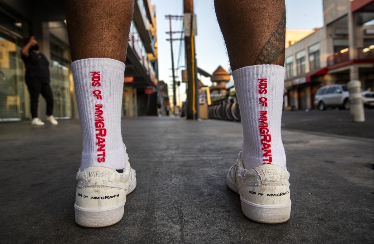 Weleh Dennis, cofounder of Kids of Immigrants, in new Vans collaboration shoes.