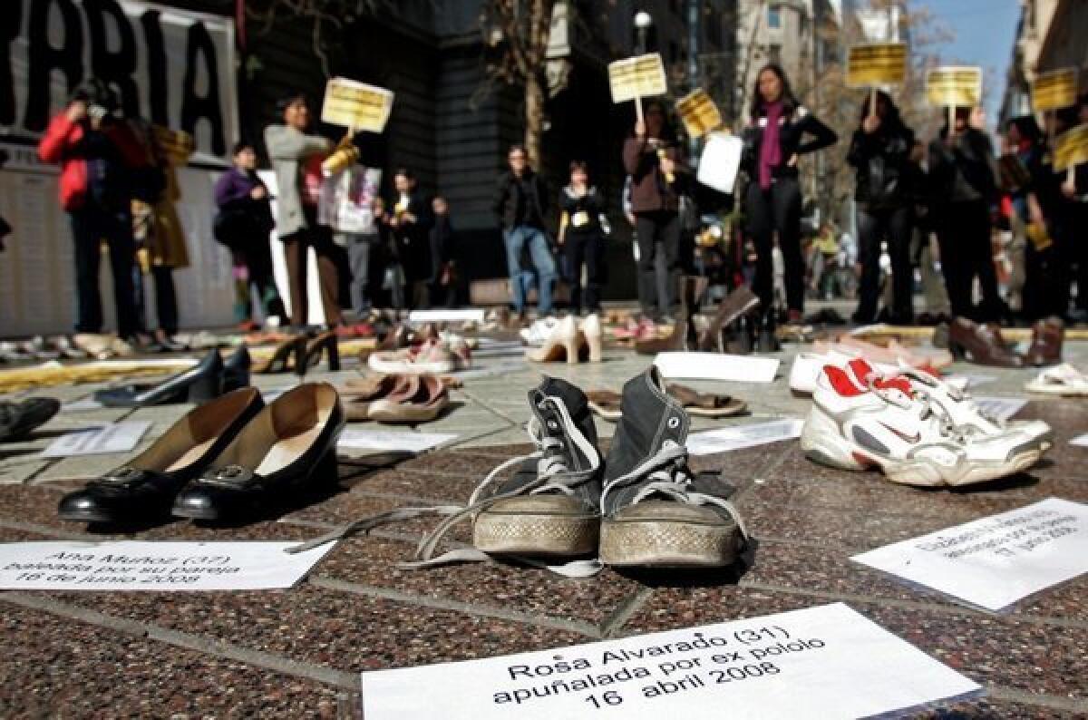 At a demonstration in Santiago, Chile, pairs of shoes represent women who have been the victims of sexual violence.