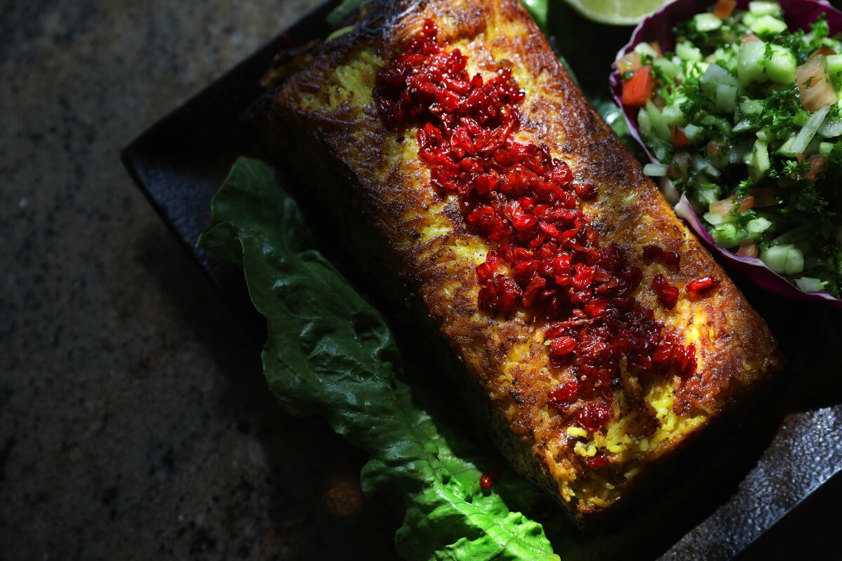 Some specials at Shamshiri Grill are available only a few days a week. Tanchin, a savory cake crowned with crimson barberries, is available on Tuesday, Wednesday and Thursday.