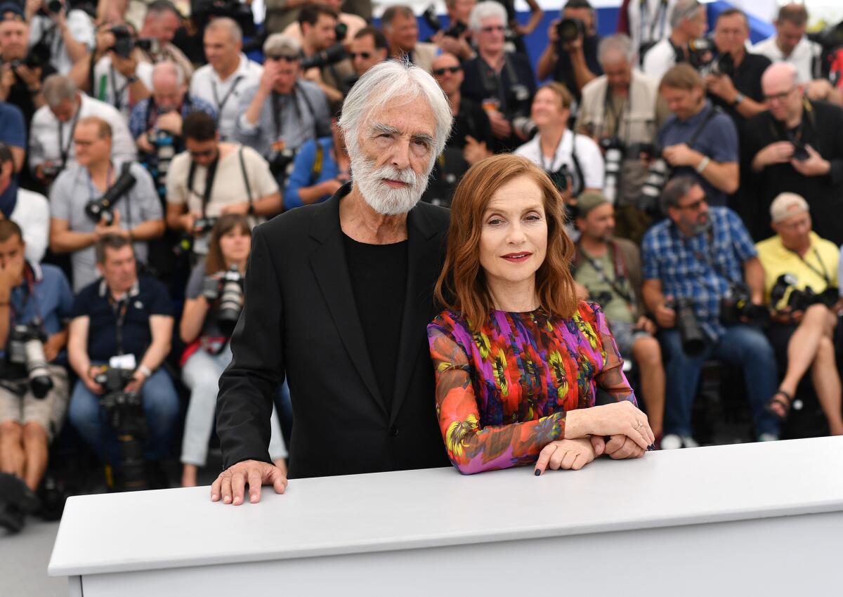 Isabelle Huppert and director Michael Haneke at the "Happy End" photocall during the 70th annual Cannes Film Festival on May 22, 2017.