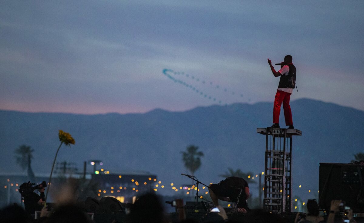 YG towers above the Sahara stage at the Coachella Valley Music and Arts Festival.