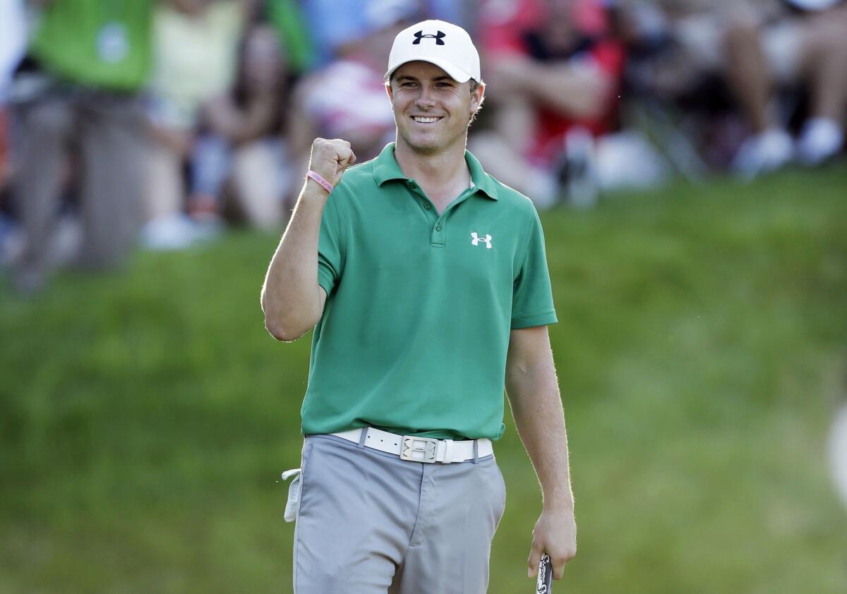 Jordan Spieth celebrates after winning the John Deere Classic on Sunday.