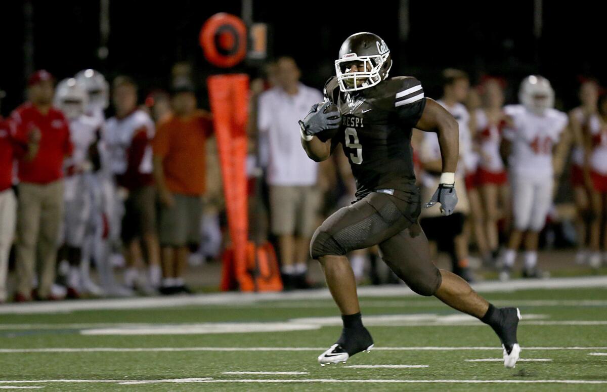 Crespi running back Jalen Starks breaks free for a touchdown against Orange Lutheran during a game on Sept. 4. Starks committed to UCLA on National signing day.