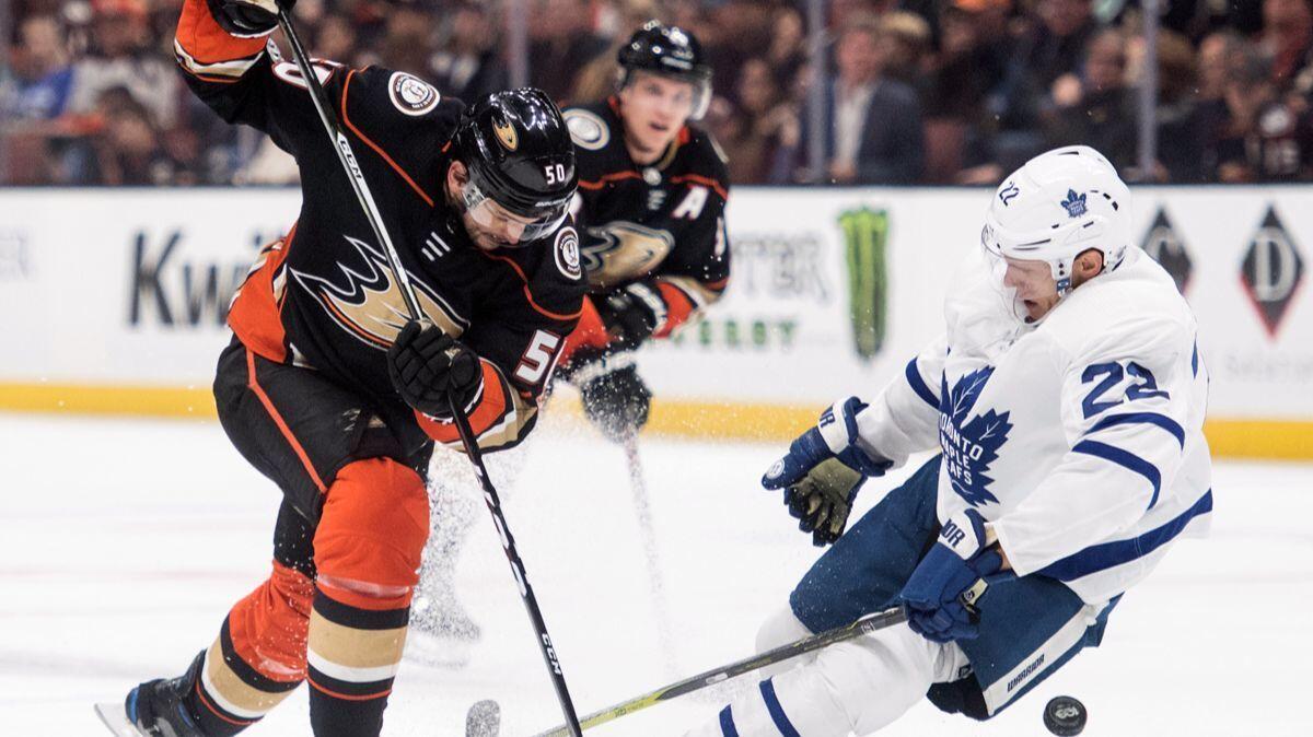 Ducks center Antoine Vermette, left, and Toronto Maple Leafs defenseman Nikita Zaitsev battle for the puck during the second period on Wednesday.
