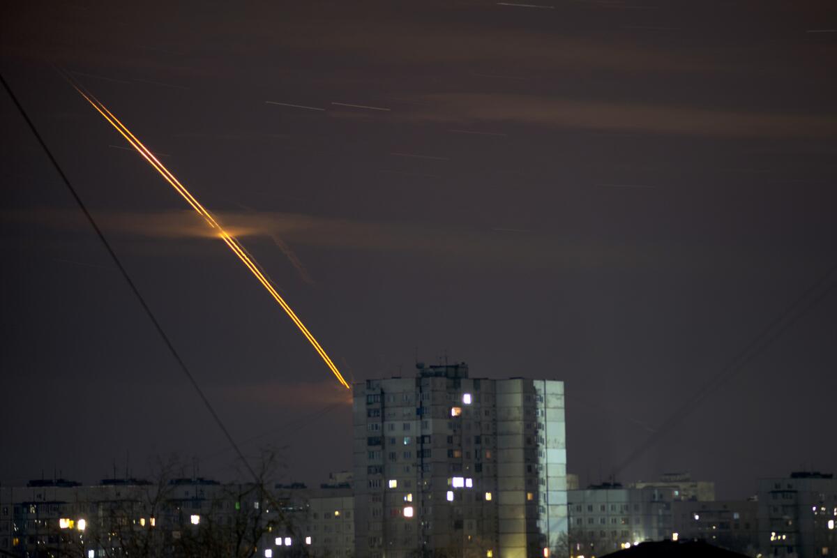 Streak of Russian rockets against the predawn sky