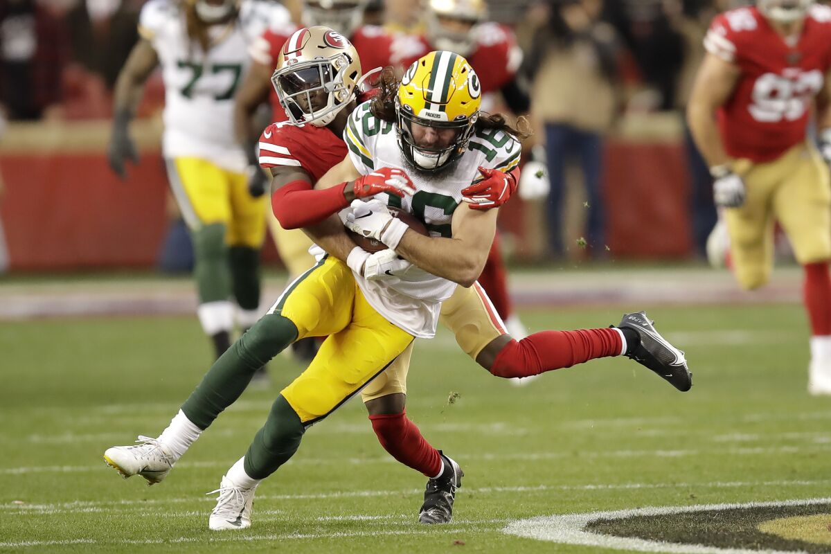FILE - In this Jan. 19, 2020, file photo, Green Bay Packers wide receiver Jake Kumerow (16) is tackled by San Francisco 49ers defensive back Emmanuel Moseley during the first half of NFL football's NFC championship game in Santa Clara, Calif. The Packers cut Kumerow, offensive lineman Alex Light and linebacker Tim Williams among others as they got their roster down to the 53-man limit before their Sept. 13 opener at Minnesota. (AP Photo/Ben Margot, File)