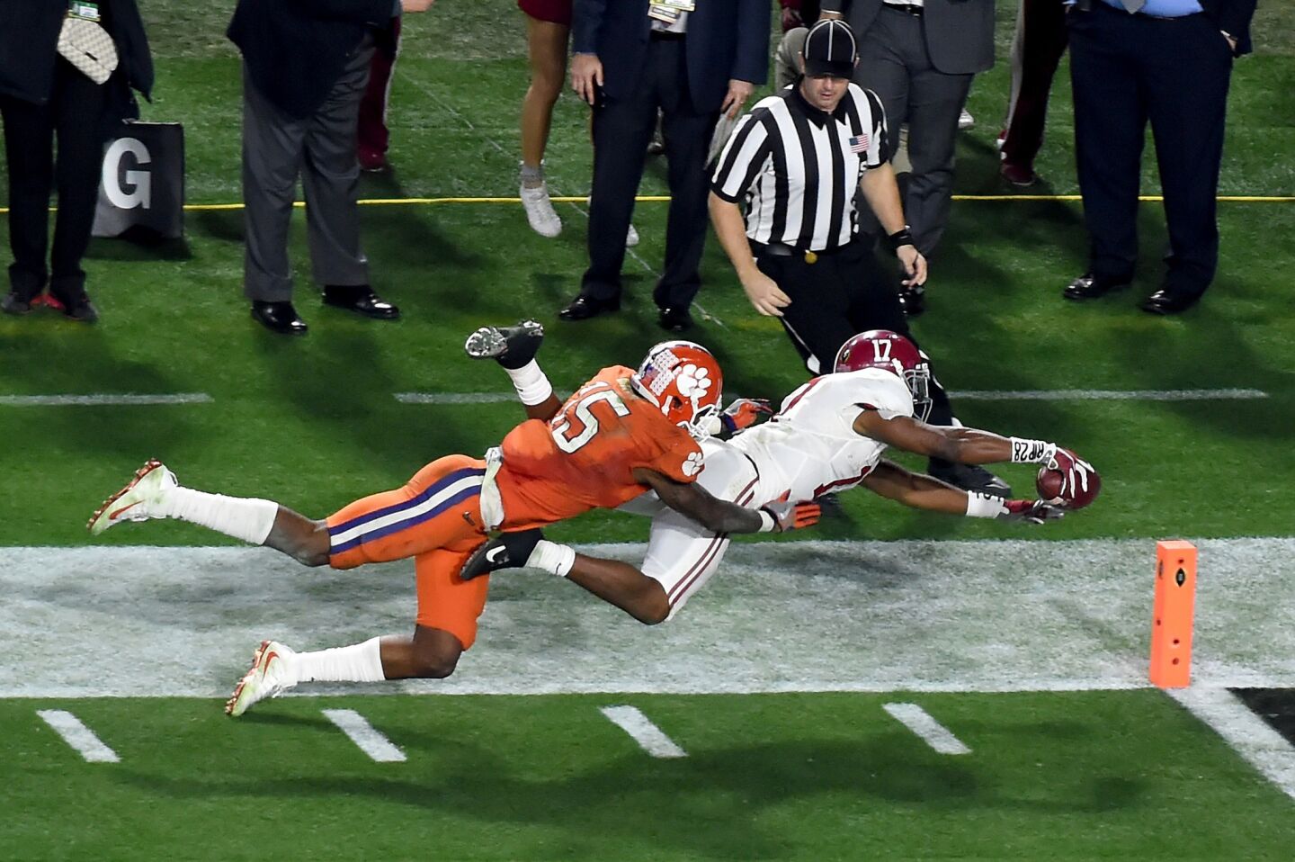 Alabama kick returner Kenyan Drake (17) dives into the end zone as he runs back a kickoff for a touchdown during the second half.