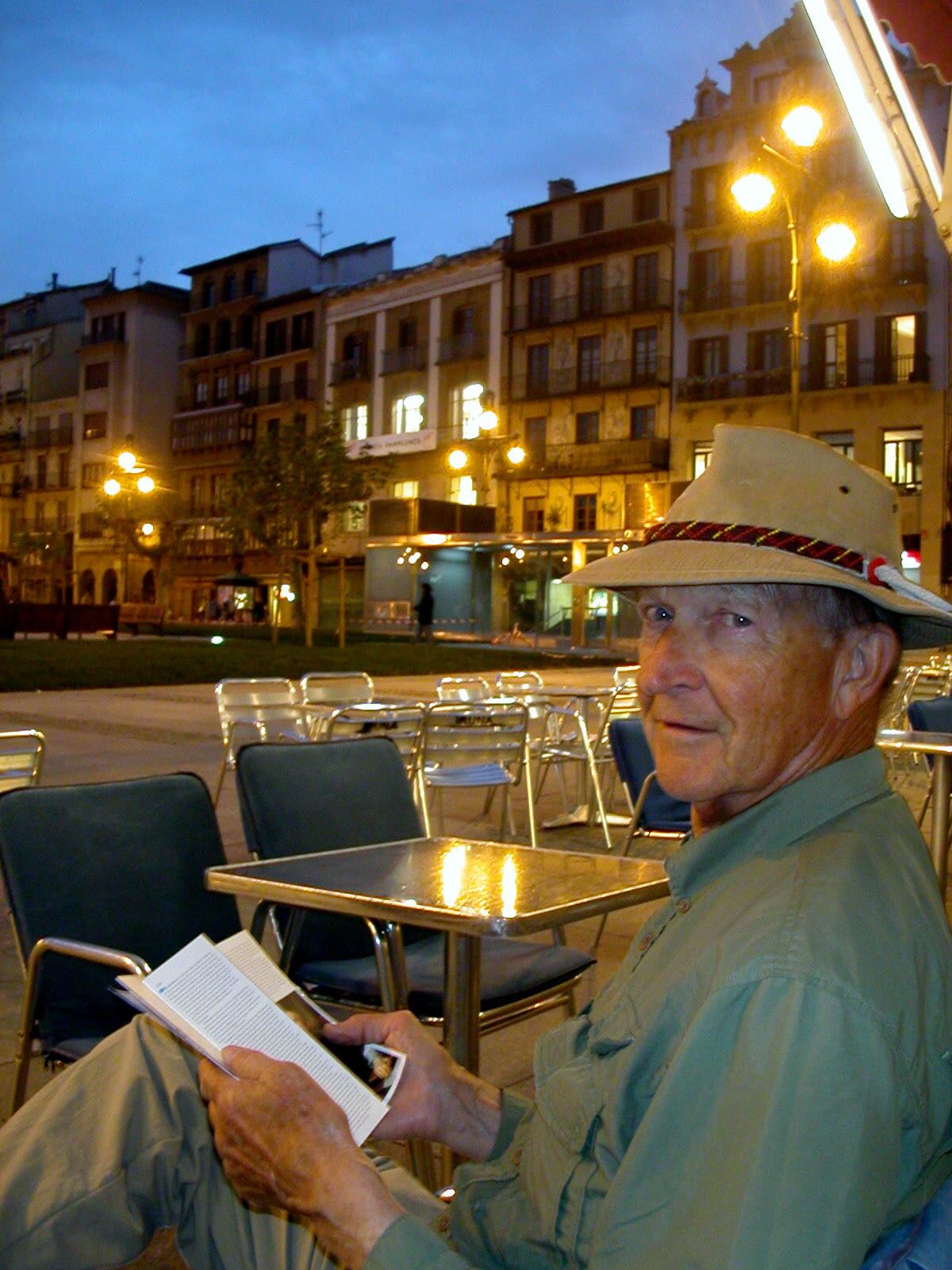 Harry Kelsey takes a break in a Spanish plaza in 2005 to check the following day's itinerary. 