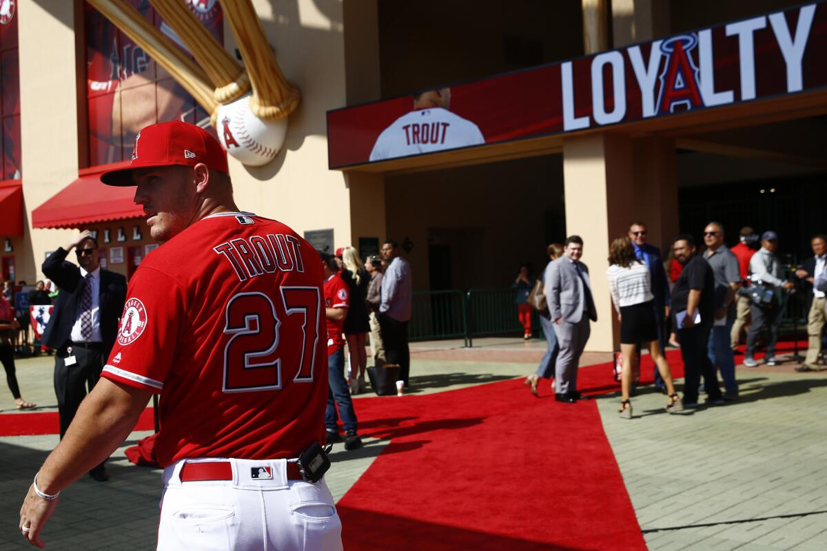 Mike Trout arrives for a news conference Sunday before the Freeway Series game against the Dodgers at Angel Stadium.