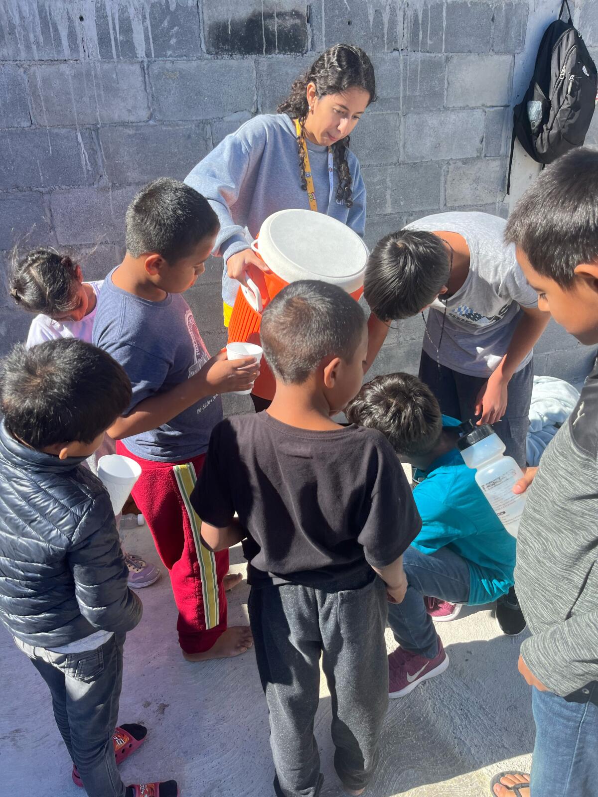 Kayleen, one of the local iACT coaches, during a water break at a immigrant shelter.