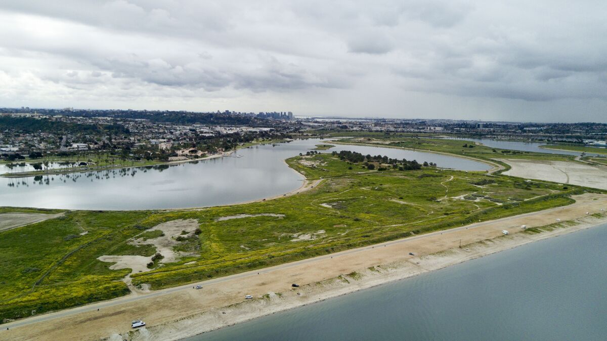 The San Diego City Council voted unanimously on Monday to fence in the leash-free dog park on Fiesta Island. The makeover also includes upgraded roads, parking and trails.