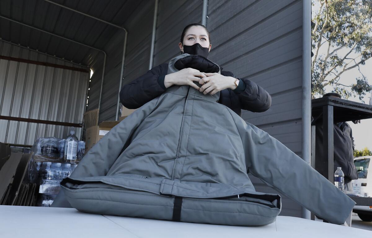 Homeless to receive 2,200 coats that convert to sleeping bags - The San  Diego Union-Tribune