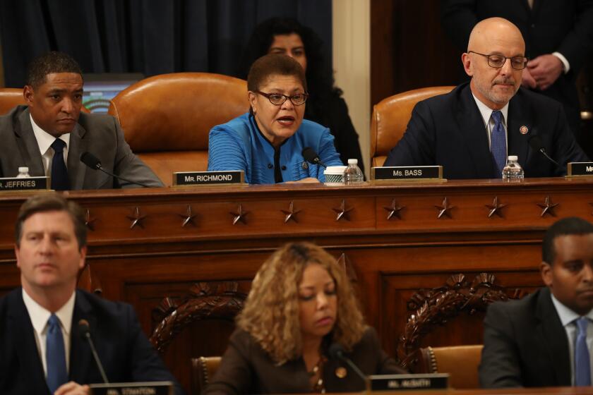 House Judiciary Committee member Rep. Karen Bass (D-Los Angeles) announces her vote in favor of the first of two articles of impeachment.