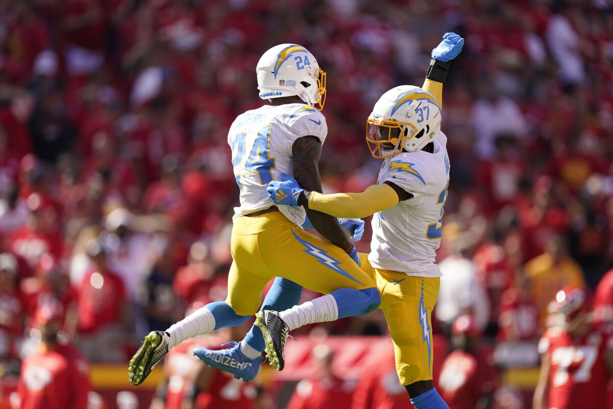 Chargers' Nasir Adderley (24) and Kemon Hall (37) after stopping the Chiefs on their last drive.