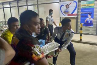 Patients at Manuel J. Santos Hospital in Butuan City, southern Philippines, are evacuated after an earthquake, Saturday evening, Dec. 2, 2023. A powerful earthquake with a preliminary magnitude of 7.6 struck Saturday off the southern Philippine coast, prompting many villagers to flee their homes in panic after Philippine authorities issued a tsunami warning. (AP Photo/Ivy Marie Mangadlao)