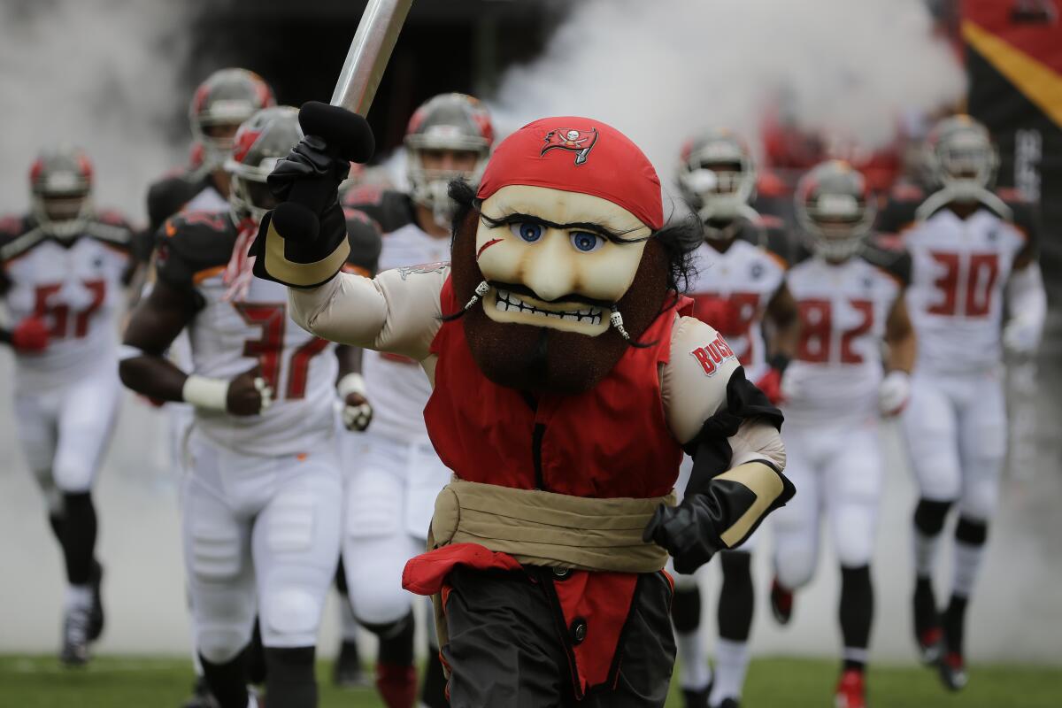 The Tampa Bay Buccaneers mascot "Captain Fear leads the team onto the field before an NFL football game